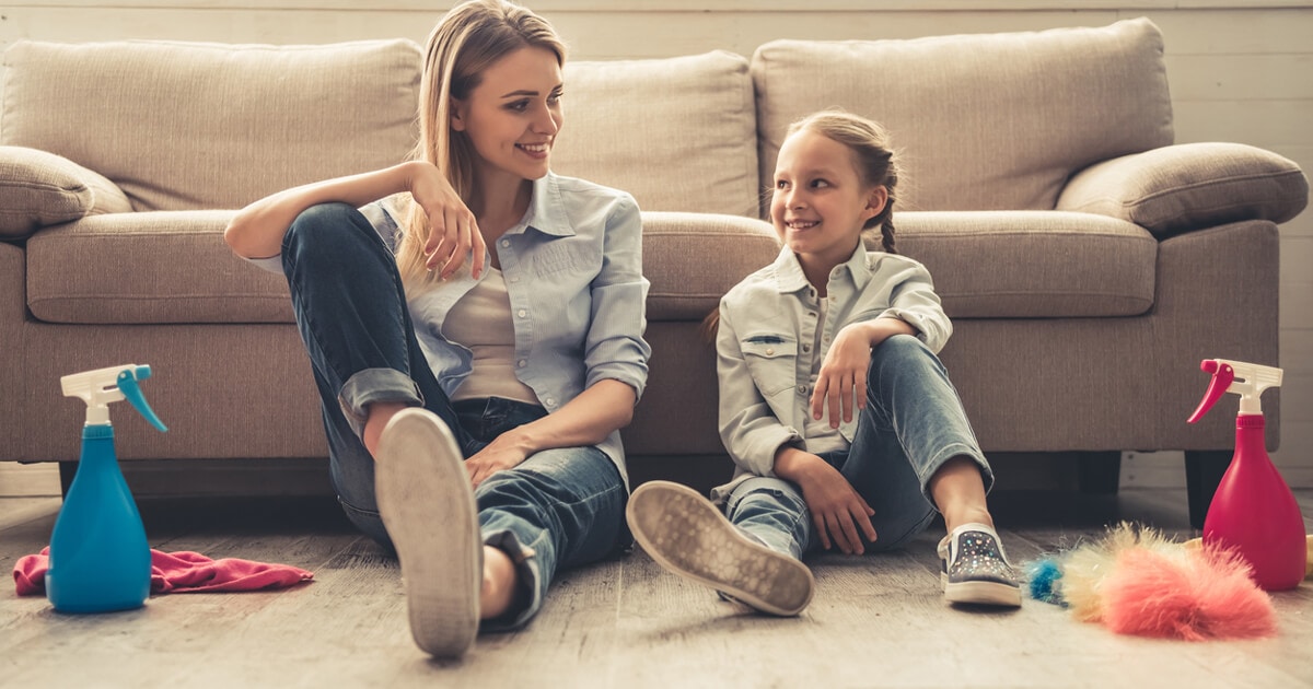 Mom and daughter sitting on their vinyl floor