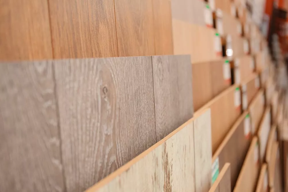 Rack of Urban Surfaces vinyl flooring products at LA Carpet Warehouse