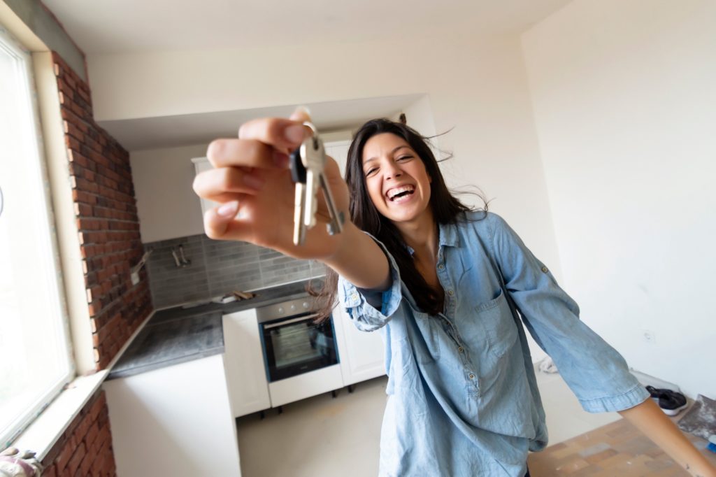 College student celebrating independence in her student housing