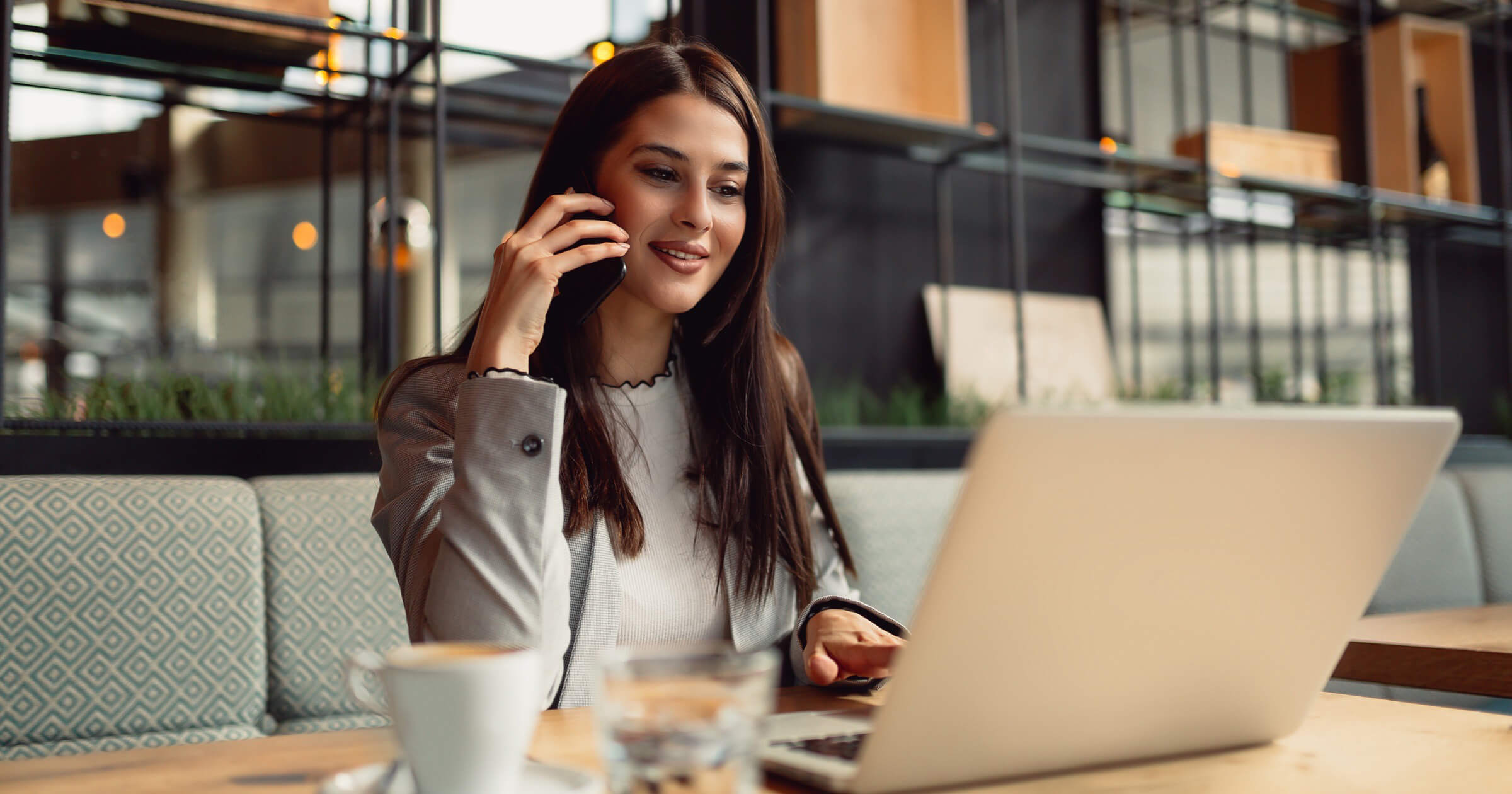 Woman talking on the phone and doing remote work at a multifamily property