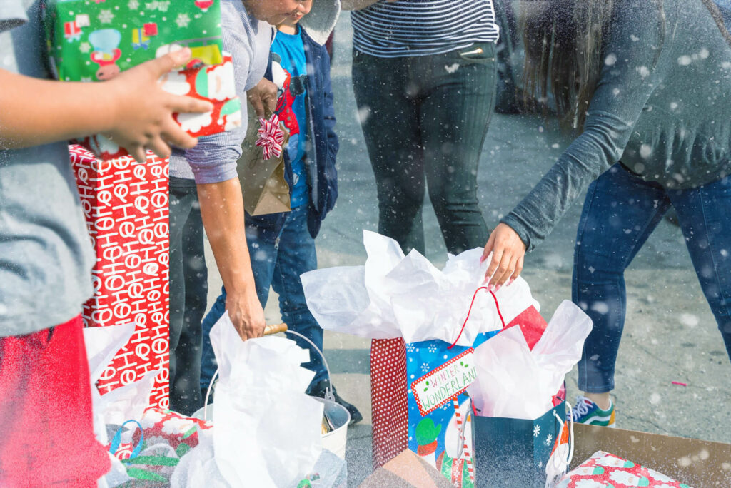 Presents being delivered to a family in the Adopt-A-Family program