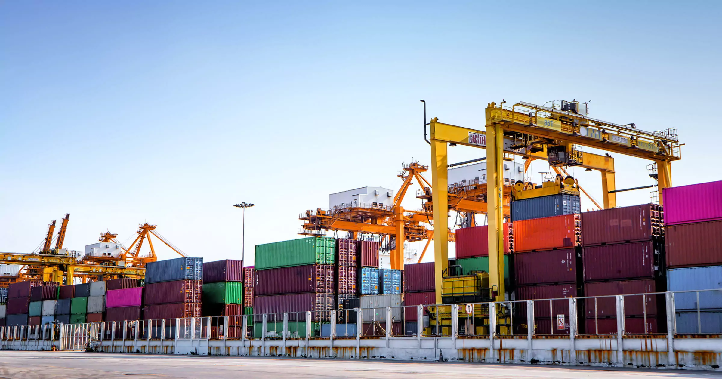 Containers at port being unloaded during the supply chain bottleneck