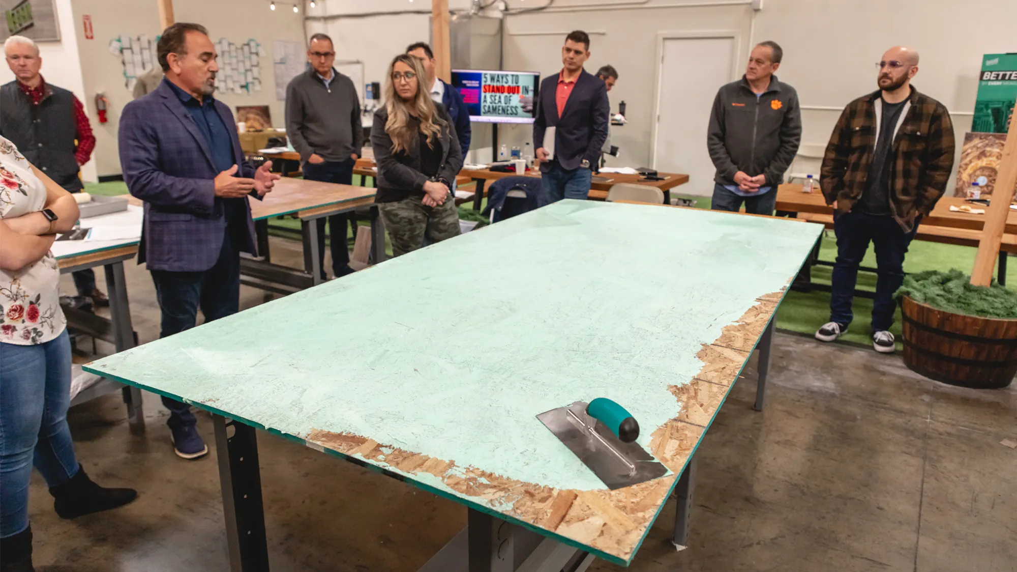Urban Surfaces' team of sales professionals learning about flooring adhesive application.