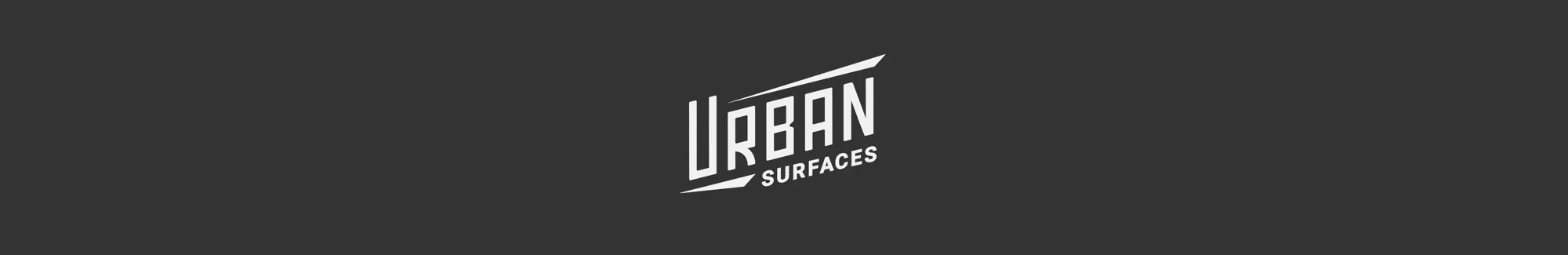 Urban Surfaces logo on gray background.