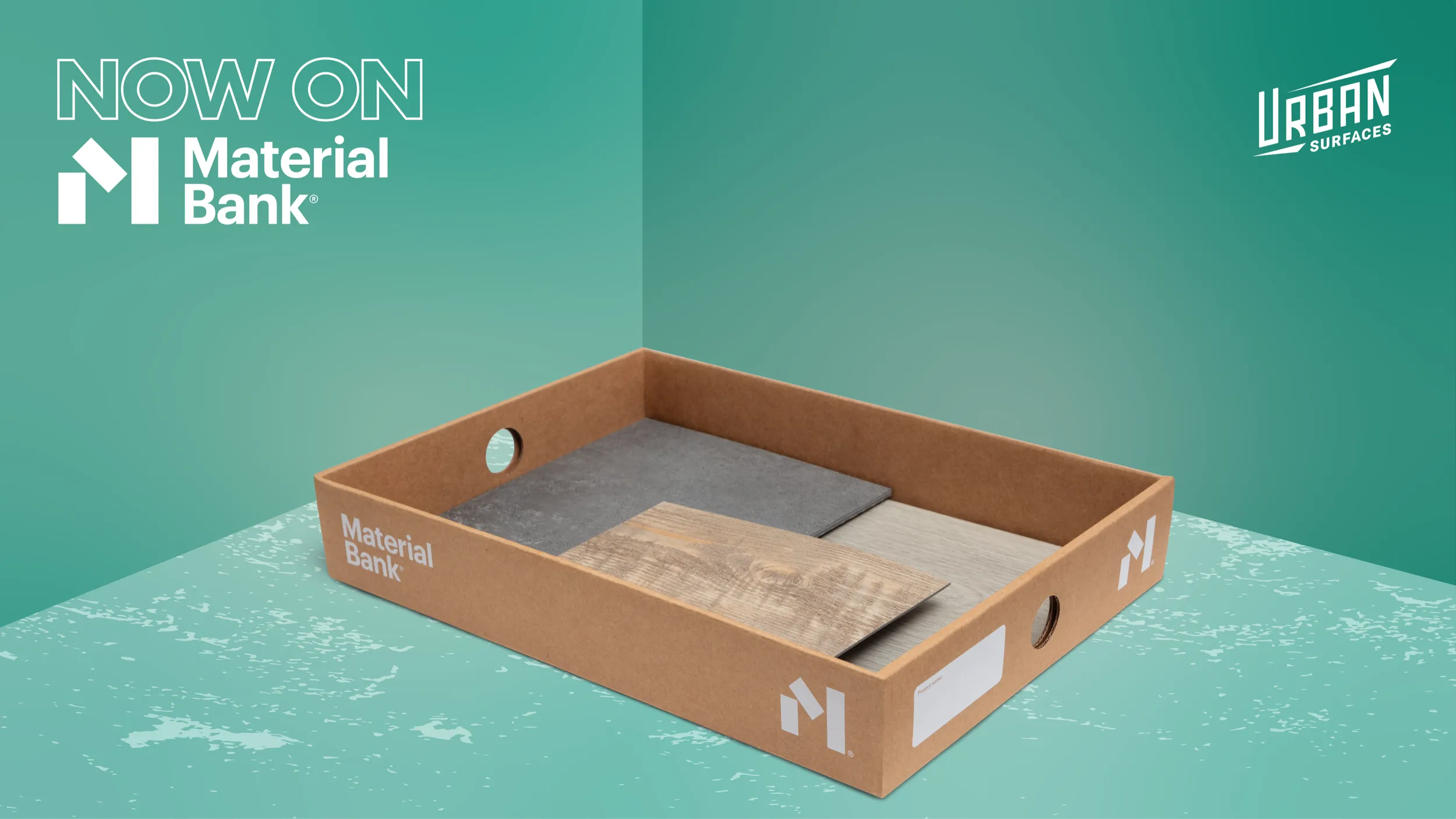 A cardboard Material Bank box with flooring samples in it. A "Now on Material Bank" badge in the top left. An Urban Surfaces logo in the top right.